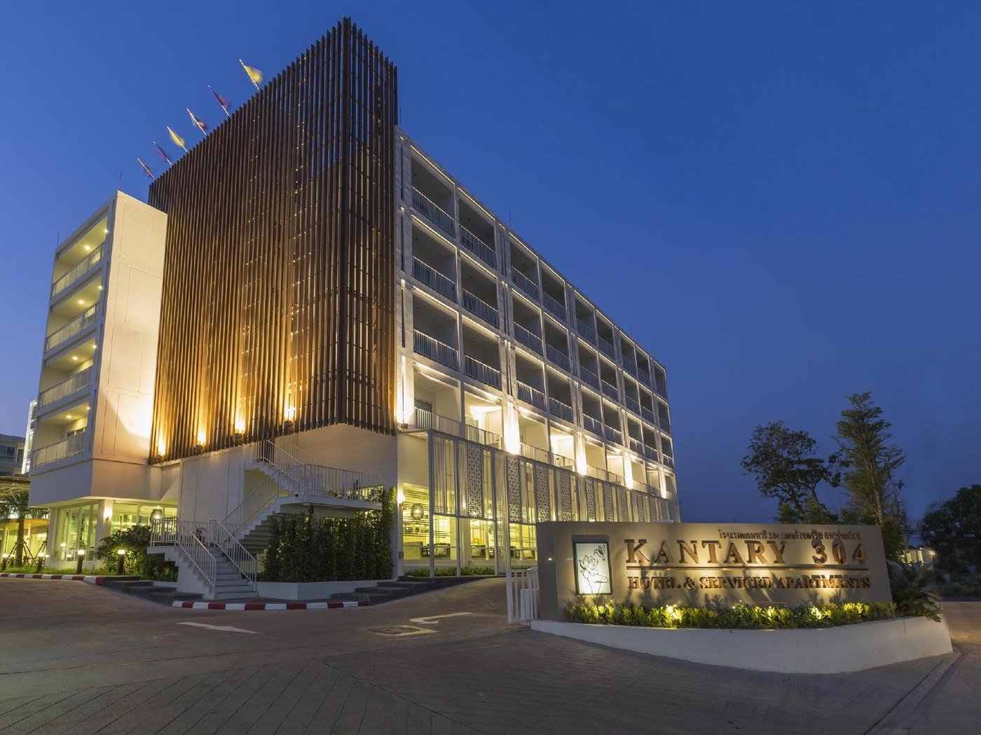 Kantary 304 hotel exterior illuminated at dusk