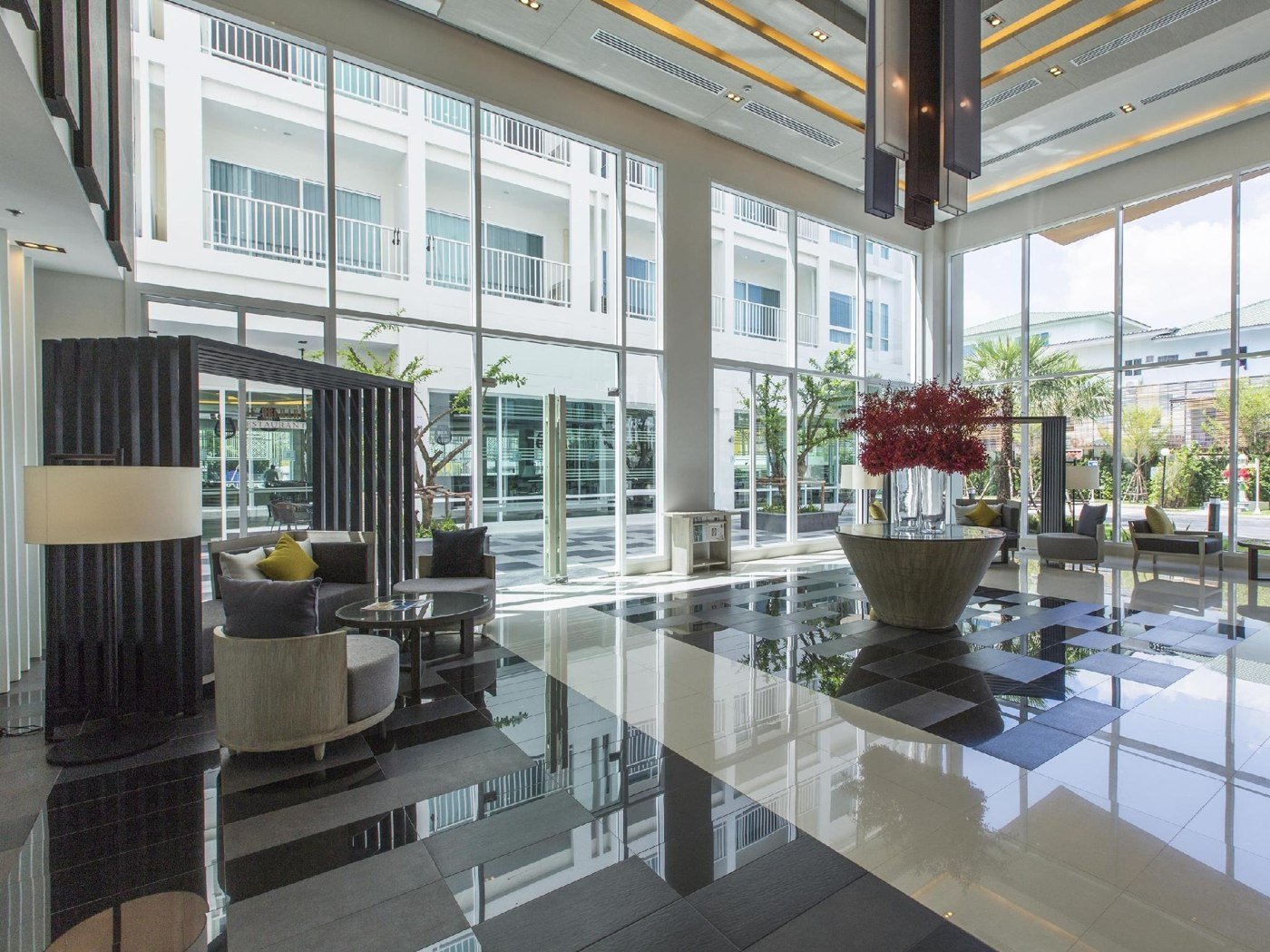 Bright double-height lobby with seating at Kantary 304