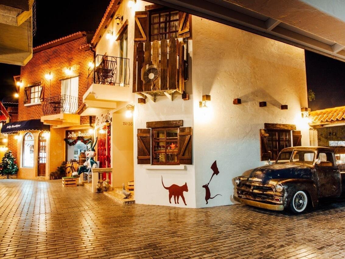 Swiss Hotel Pattaya exterior at night with a parked vintage-style vehicle