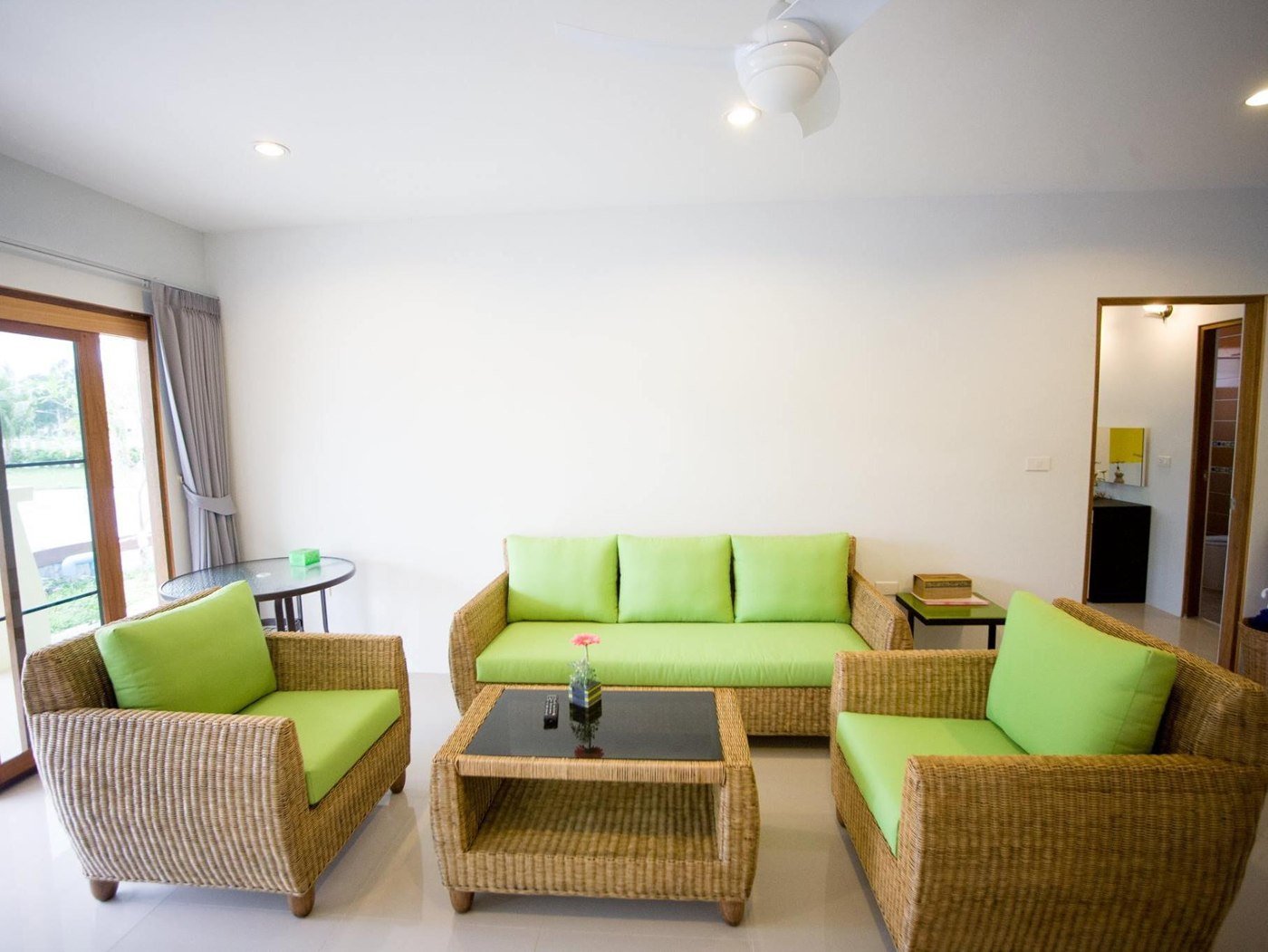 Living area with green seating at Thai O.T. Khaolak Resort