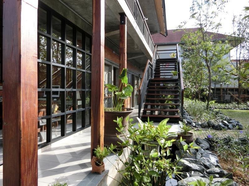 Garden walkway and exterior stairs at Yellow Pillow Hotel